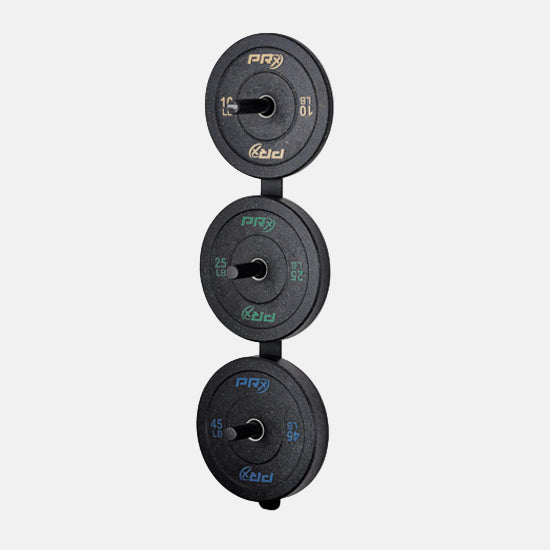 Set of black weight plates on PRX wall mount plate storage