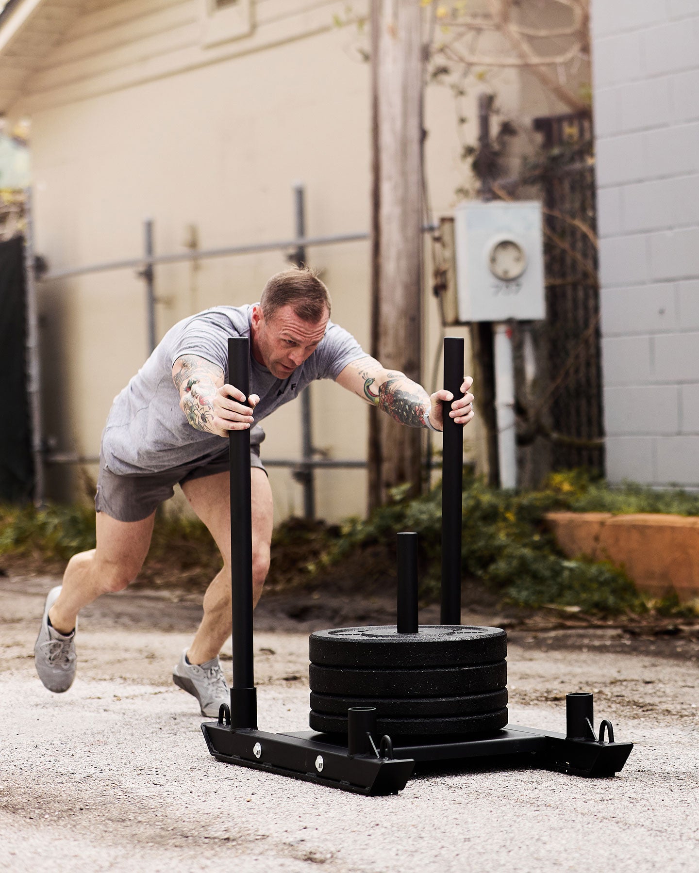 ATHLETE PUSHING WEIGHT SLED