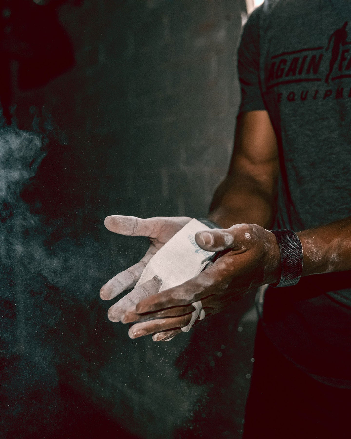 gym chalk on athlete hands