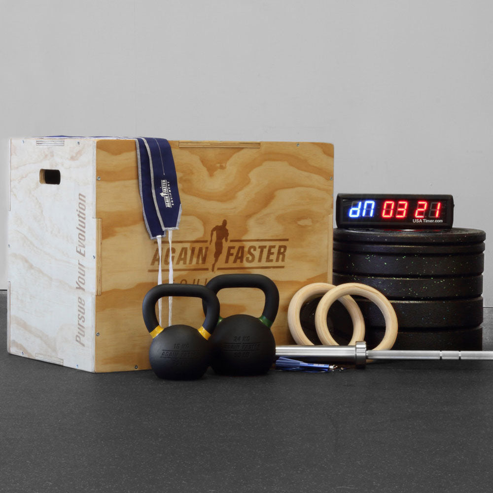 home gym weight package with olympic barbell crumb bumper plates kettlebell plyo box