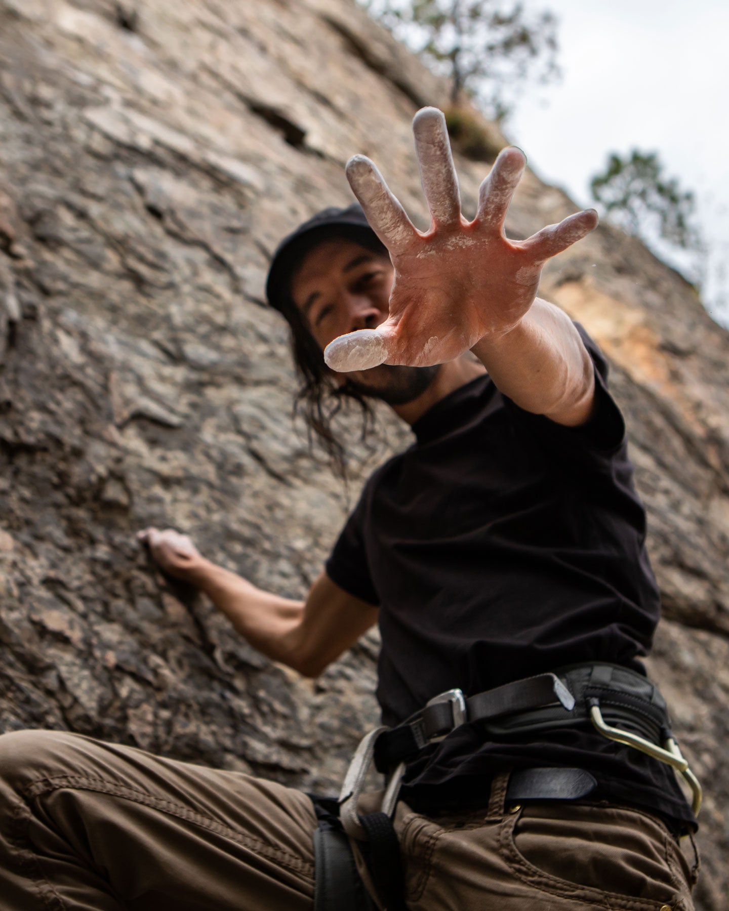 rock climber with chalk hands